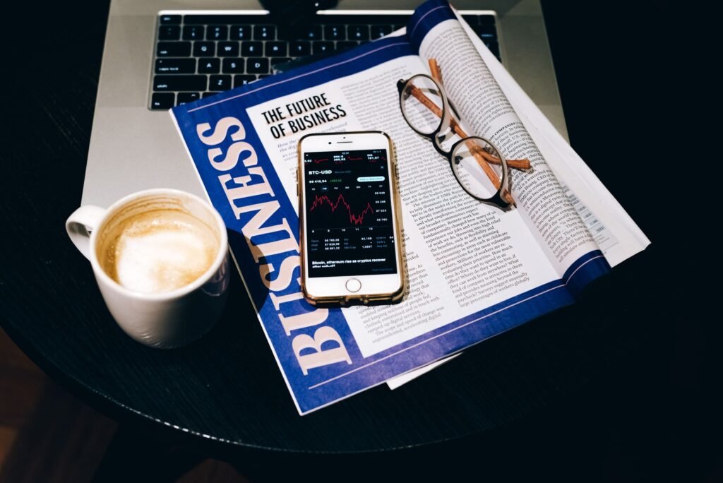 Laptop showing newsletter sponsor ad slot with smartphone next to it